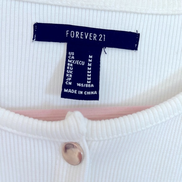 Size M fits more like a small, long, fitted cream color with gold metal snaps - Picture 9 of 15